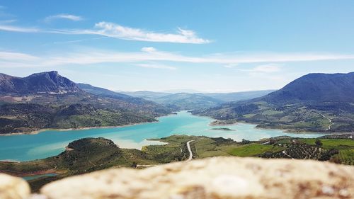 Scenic view of lake and mountains against sky