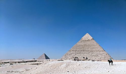 Pyramid against clear blue sky 