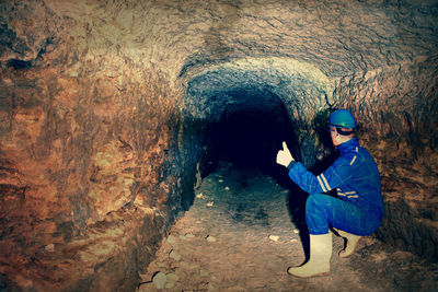 Portrait of man standing in cave