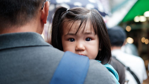 Close-up portrait of cute mother with baby