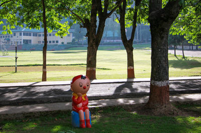 Full length of toy on tree in park