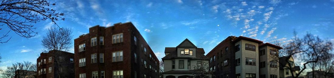 Low angle view of building against cloudy sky