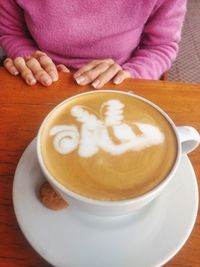 Close-up of coffee cup on table