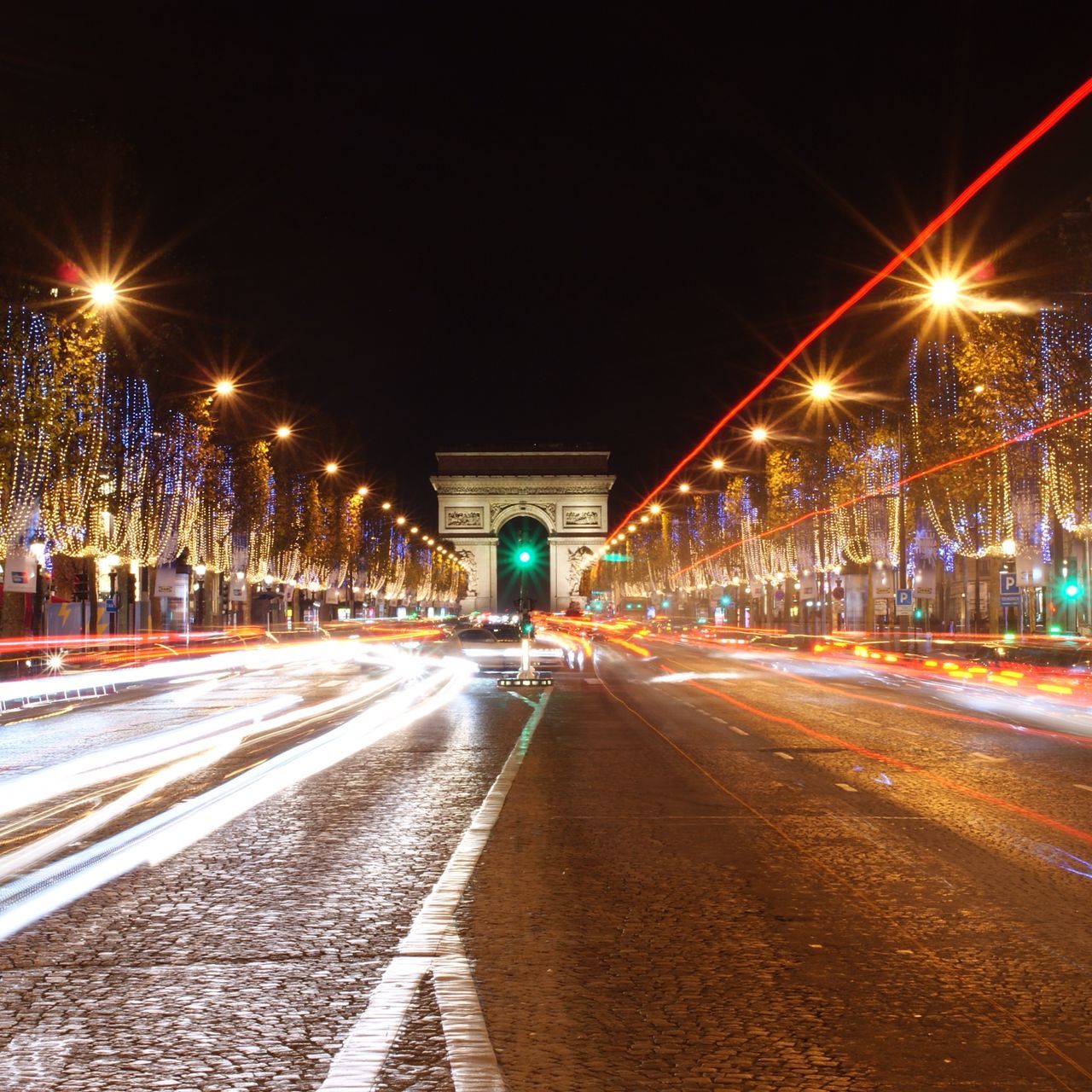 illuminated, night, transportation, the way forward, street light, light trail, road, lighting equipment, long exposure, street, motion, city, diminishing perspective, speed, road marking, built structure, blurred motion, architecture, vanishing point, building exterior