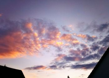 Low angle view of cloudy sky at sunset