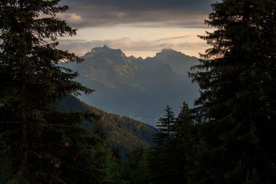 Scenic view of mountains against sky at sunset