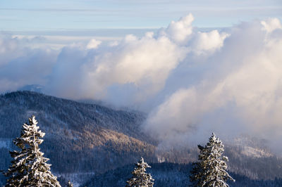 Scenic view of snow covered mountains against sky