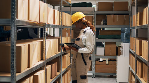 Side view of man working in factory