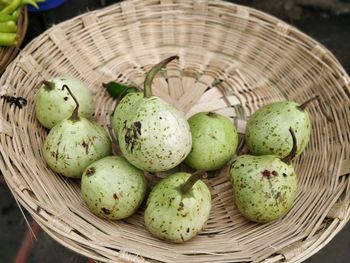 High angle view of fruits in basket on table