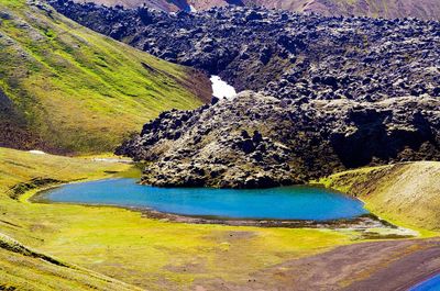 High angle view of lake amidst land