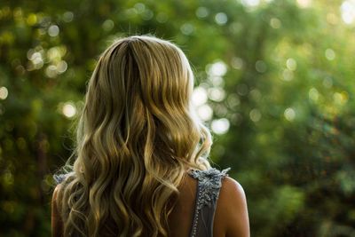 Rear view of woman in forest