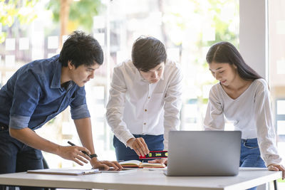 Group of people working on table