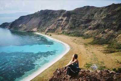 High angle view of woman on top of mountain