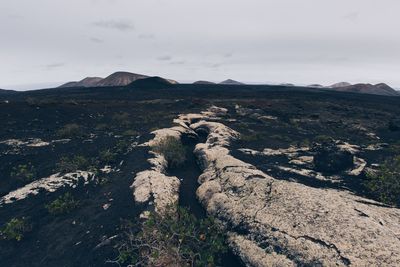 Scenic view of volcanic tube against sky