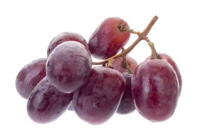 Close-up of grapes against white background