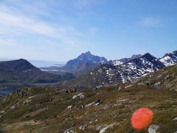 Scenic view of landscape and mountains against sky