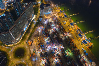 High angle view of city lit up at night