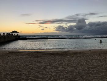 Scenic view of sea against sky at sunset