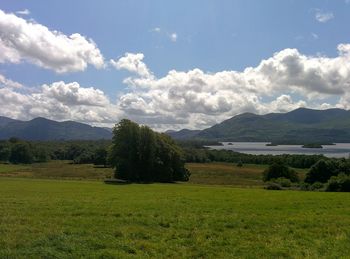 Scenic view of lake against cloudy sky