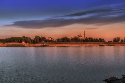 Scenic view of lake against sky during sunset