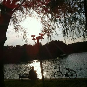 Sun shining over calm lake