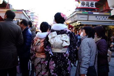 People standing on street in city