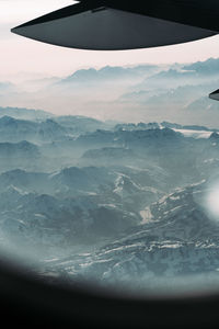 Aerial view of landscape and mountains against sky