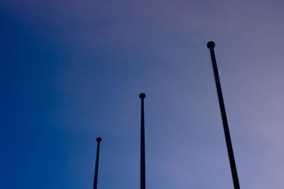 Low angle view of street light against clear blue sky