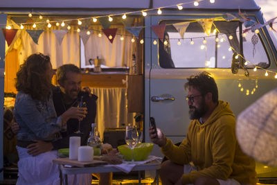 Friends sitting on campsite