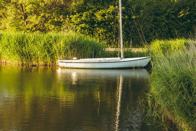 Boats moored in lake