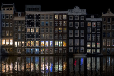 Reflection of building in river at night