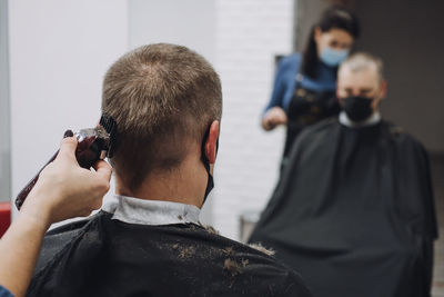 Rear view of man photographing