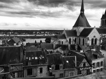 View of town against cloudy sky