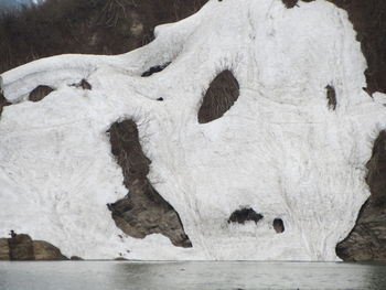 Close-up of snow on rock during winter