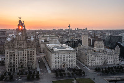 High angle view of city buildings during sunset