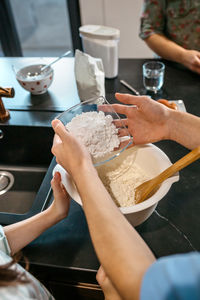 Cropped hands of person preparing food