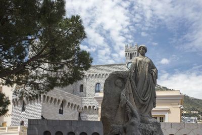 Low angle view of statue against sky