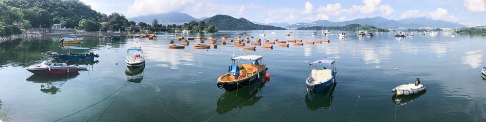 High angle view of boats moored in lake against sky