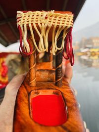 Close-up of a miniature boat against lake