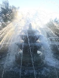 Rear view of people splashing water