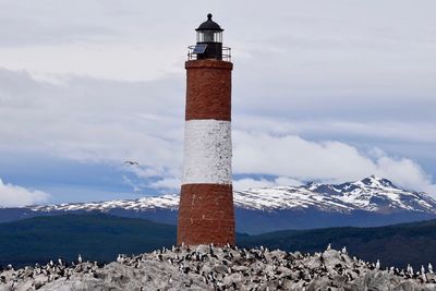 Lighthouse against sky during winter