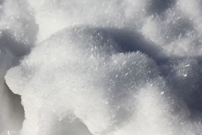 Close-up of snow against sky