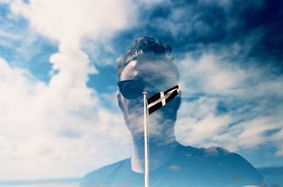 Low angle view of person against sky