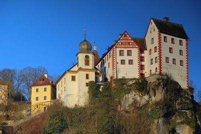 Scenic view of the castle of egloffstein against a blue sky