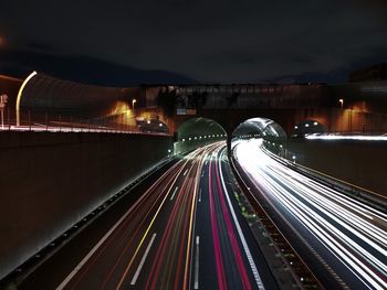 High angle view of light trails on road at night
