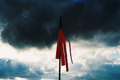 Low angle view of flag against sky