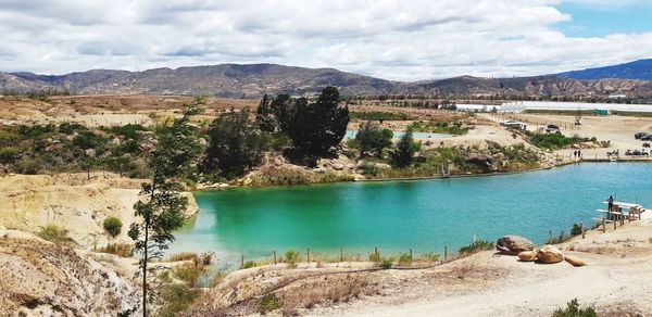 Scenic view of sea against cloudy sky