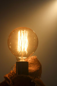 Close-up of illuminated light bulb