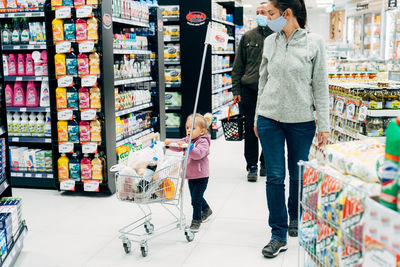 Women standing on display at store