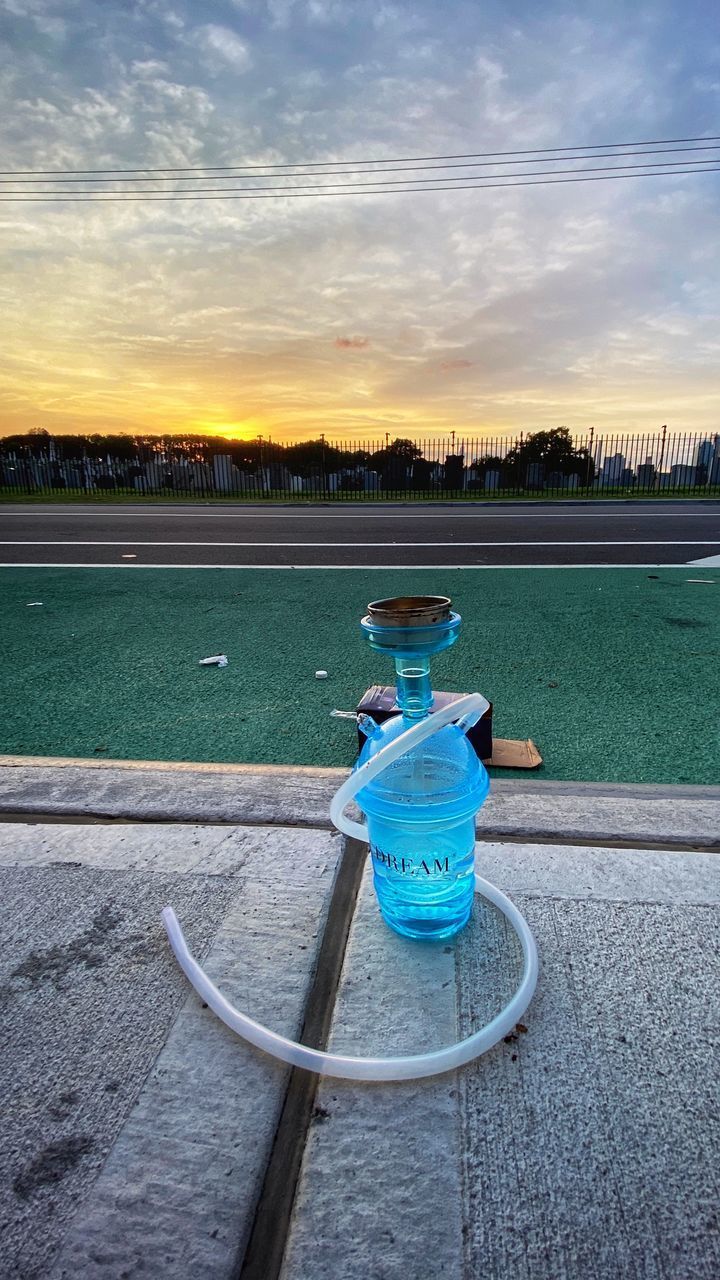 VIEW OF DRINK ON ROAD AGAINST SKY